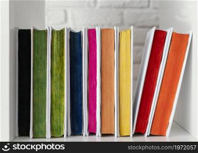 colorful books shelf arrangement. High resolution photo. colorful books shelf arrangement. High quality photo