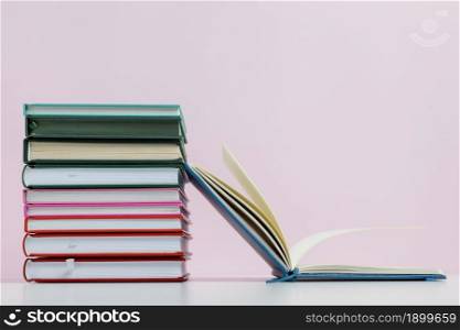 colorful books with pink background arrangement. Resolution and high quality beautiful photo. colorful books with pink background arrangement. High quality beautiful photo concept