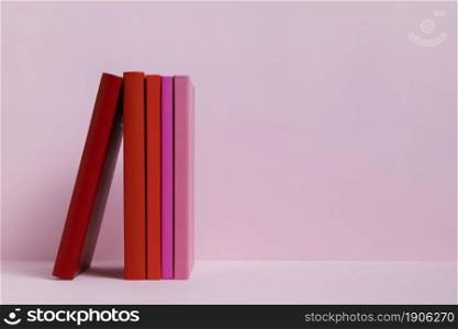 colorful books with pink background. High resolution photo. colorful books with pink background. High quality photo