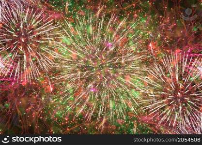 Colorful bright fireworks against dark sky