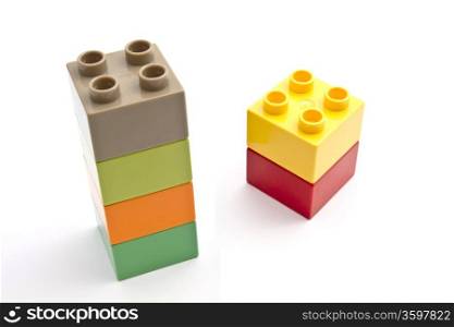 Colorful building blocks closeup on white