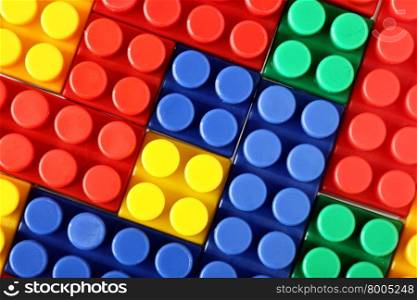 Colorful building blocks of meccano, may be used as background