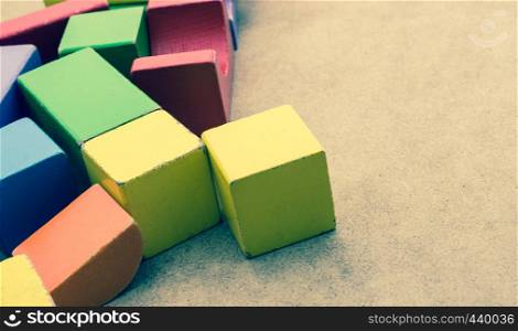 Colorful building blocks on a brown background