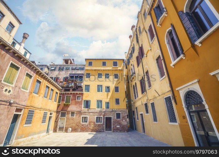 Colorful buildings with many windows in a backyard in Venice Italy