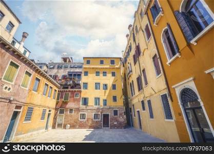 Colorful buildings with many windows in a backyard in Venice Italy