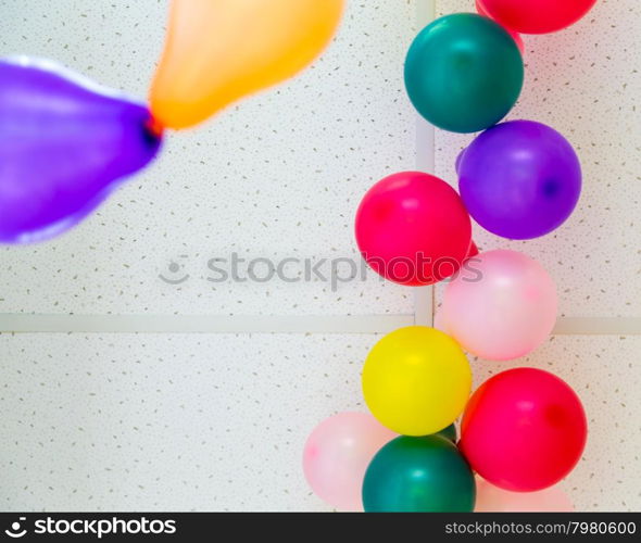 Colorful bunch of balloons hanging from ceiling