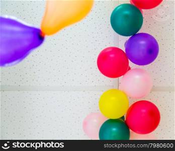 Colorful bunch of balloons hanging from ceiling