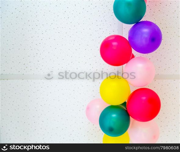 Colorful bunch of balloons hanging from ceiling