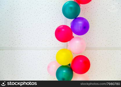 Colorful bunch of balloons hanging from ceiling