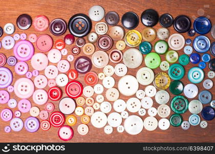 Colorful buttons as a rainbow background for design. Colorful buttons macro