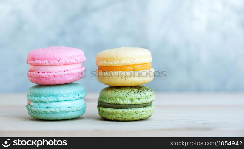 colorful cake macaron or macaroon on wooden background.