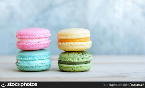 colorful cake macaron or macaroon on wooden background.