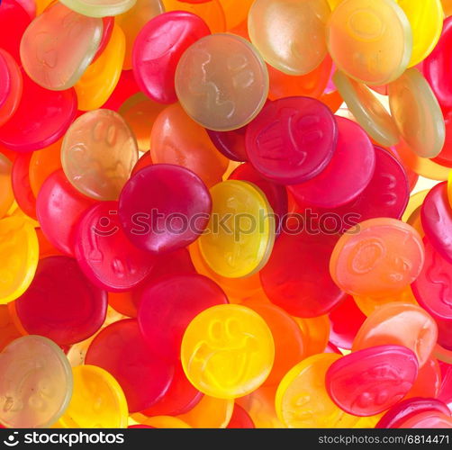 Colorful candy faces on a white background