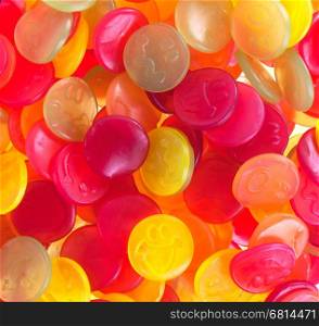 Colorful candy faces on a white background