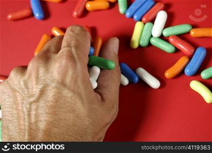 colorful candy on vivid red background