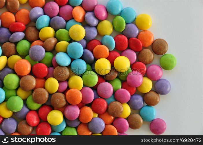 Colorful candy on white background. Chocolate snack.