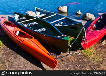 Colorful canoes. canoes lying on the shore in the sun