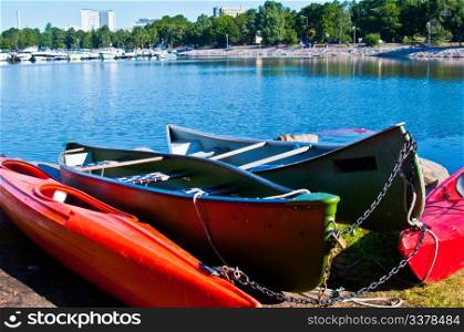 Colorful canoes. canoes lying on the shore in the sun