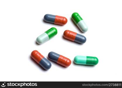 Colorful capsules isolated on white background