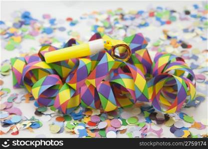 Colorful carnival background with stripes and whistle;