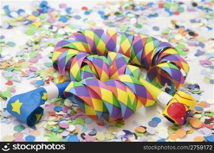 Colorful carnival background with stripes and whistles