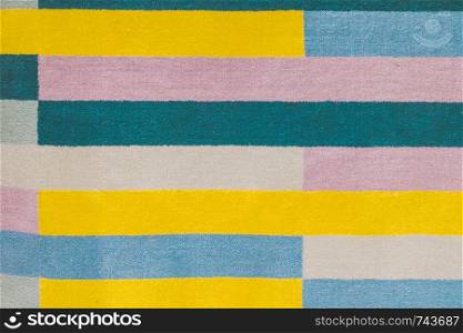Colorful carpet with hand made graphic pattern.