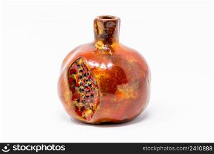 COlorful ceramic pomegranate close up cut isolated. COlorful ceramic pomegranate close up isolated