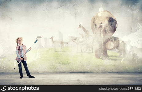 Colorful childhood. Cute girl of school age painting wall with roller