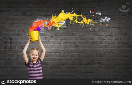 Colorful childhood!. Cute girl with bucket and colorful springs coming out