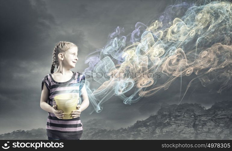 Colorful childhood!. Cute girl with bucket and colorful springs coming out