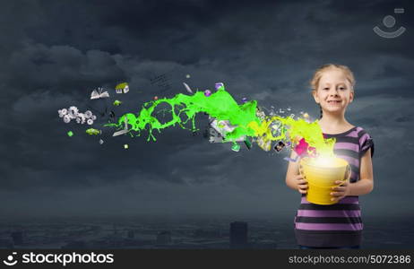 Colorful childhood!. Cute girl with bucket and colorful springs coming out