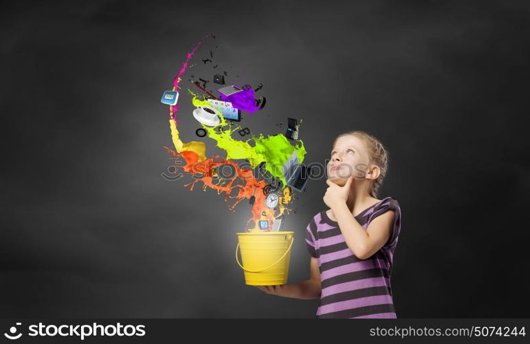 Colorful childhood!. Cute girl with bucket and colorful springs coming out