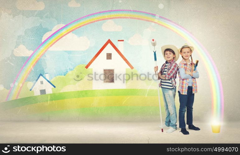 Colorful childhood. Two children of school age painting wall with roller