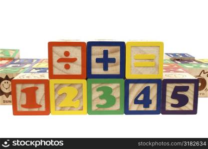 Colorful children&acute;s blocks over white.