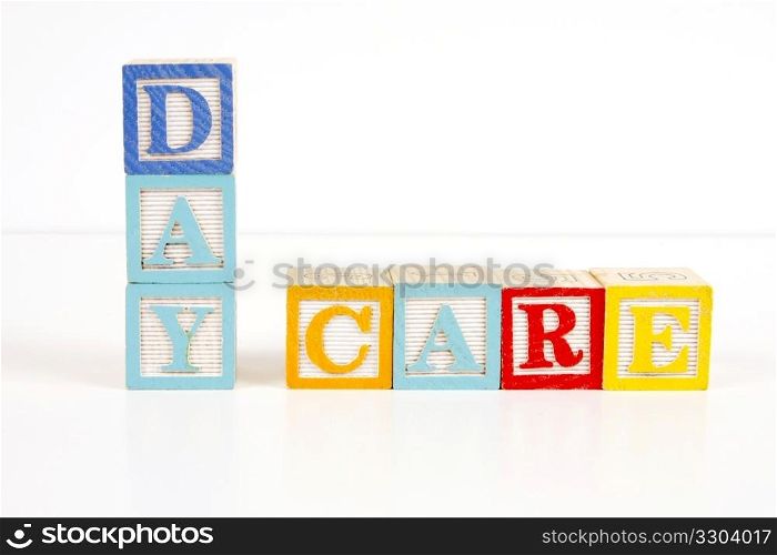 Colorful childrens blocks spell the words day care.
