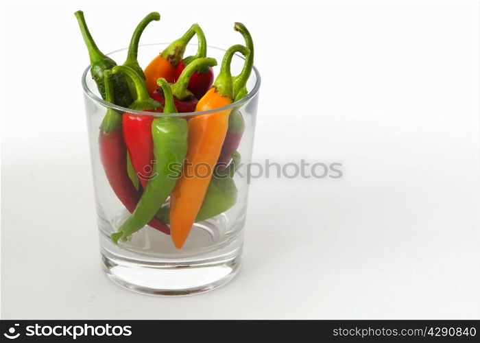 colorful chili peppers on a white background