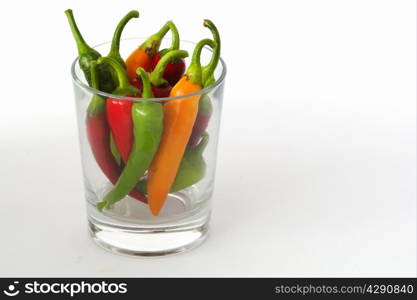 colorful chili peppers on a white background