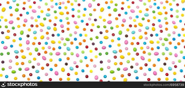 Colorful chocolate candy pills isolated on white background.. Colorful candies isolated