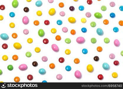 Colorful chocolate candy pills isolated on white background. Top view. Colorful chocolate candy pills