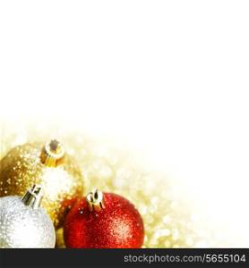 Colorful christmas balls on shining glitter background with white copy space
