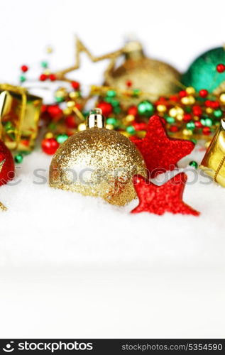 Colorful Christmas decoration and gifts on snow