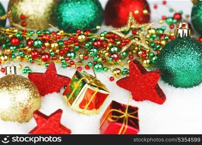 Colorful Christmas decoration and gifts on snow