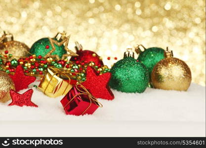 Colorful Christmas decoration and gifts on snow