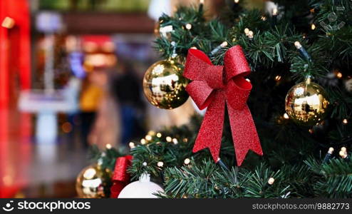 Colorful christmas Decoration. Winter holidays and traditional ornaments on a Christmas tree. Lighting chains - candles for seasonal background.