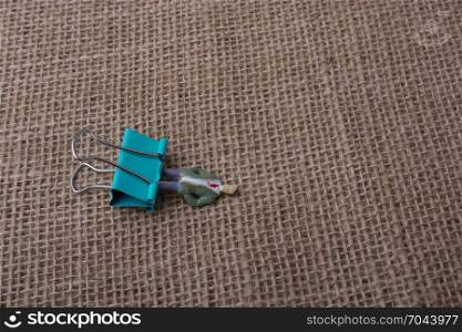 Colorful clip placed on a linen canvas