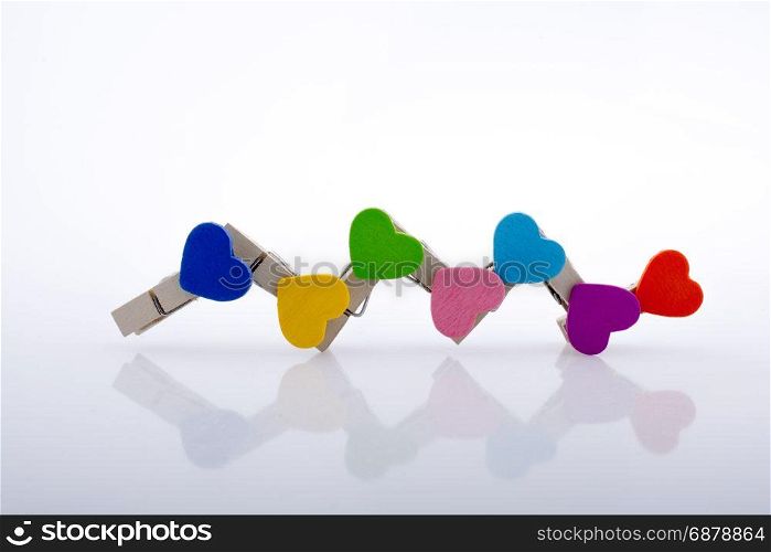 Colorful clothespin attached one another form a zigzag