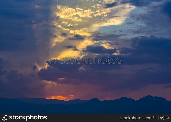 Colorful clouds and light flashes at sunset