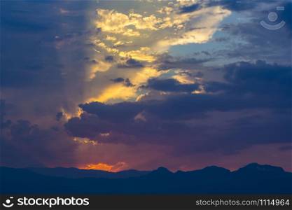 Colorful clouds and light flashes at sunset