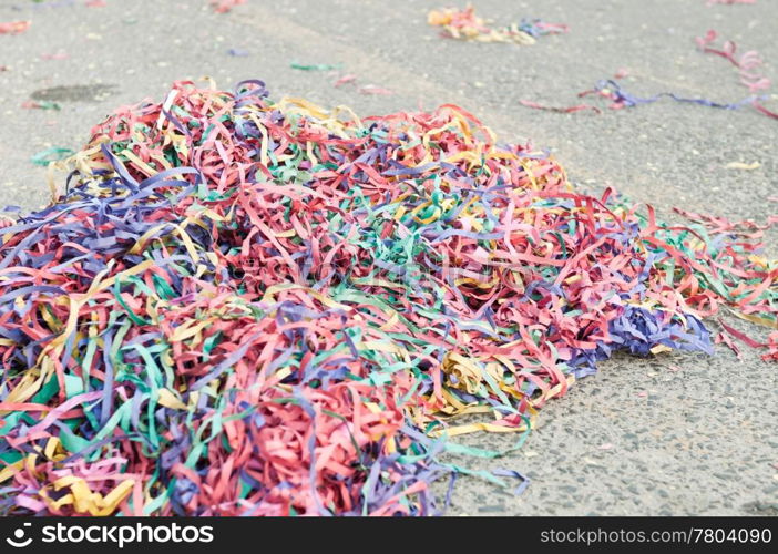 colorful confetti and streamers at the street after Carnival Parade