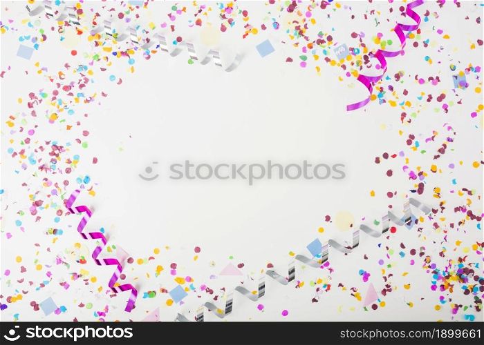 colorful confetti curling streamers white background with space text. Resolution and high quality beautiful photo. colorful confetti curling streamers white background with space text. High quality beautiful photo concept
